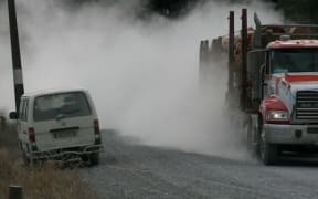 logging truck on gravel roadno captions Northland