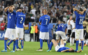 Italy players react during their Euro 2016 quarter-final penalty shootout defeat to Germany