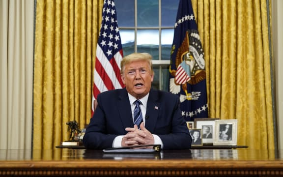 US President Donald Trump addresses the Nation from the Oval Office about the widening novel coronavirus (Covid-19) crisis in Washington, DC on March 11, 2020.