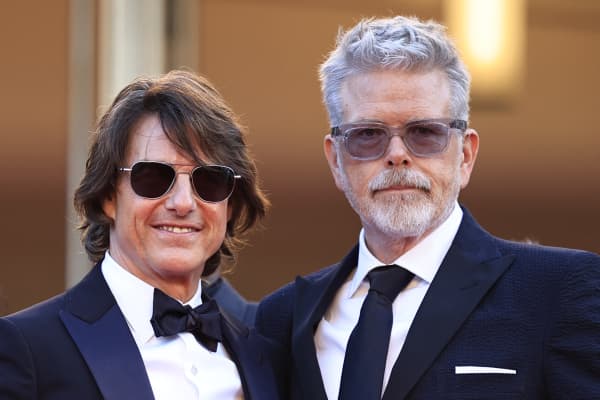 US actor and producer Tom Cruise (L) and US film director, screenwriter Christopher Mcquarrie (R) arrive for the screening of the film "Mission: Impossible - The Final Reckoning" at the 78th edition of the Cannes Film Festival in Cannes, southern France, on May 14, 2025. (Photo by Valery HACHE / AFP)