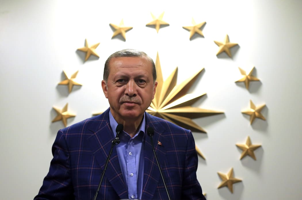 Turkish President Recep Tayyip Erdogan gives a speech during a press conference as the unofficial preliminary results of Turkey’s constitutional referendum show "Yes" votes ahead of "No" votes, at Turkish Presidency's Huber Mansion in Istanbul.