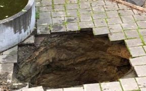 The hole in the patio at Andrew Thomson's Otago home.