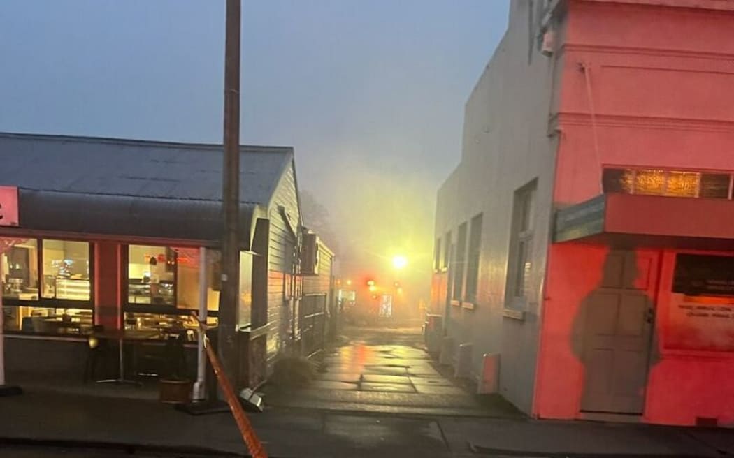 A person was hospitalised after a fire in Fairlie in the early hours of Monday 20 November 2023 which also gutted three shops.