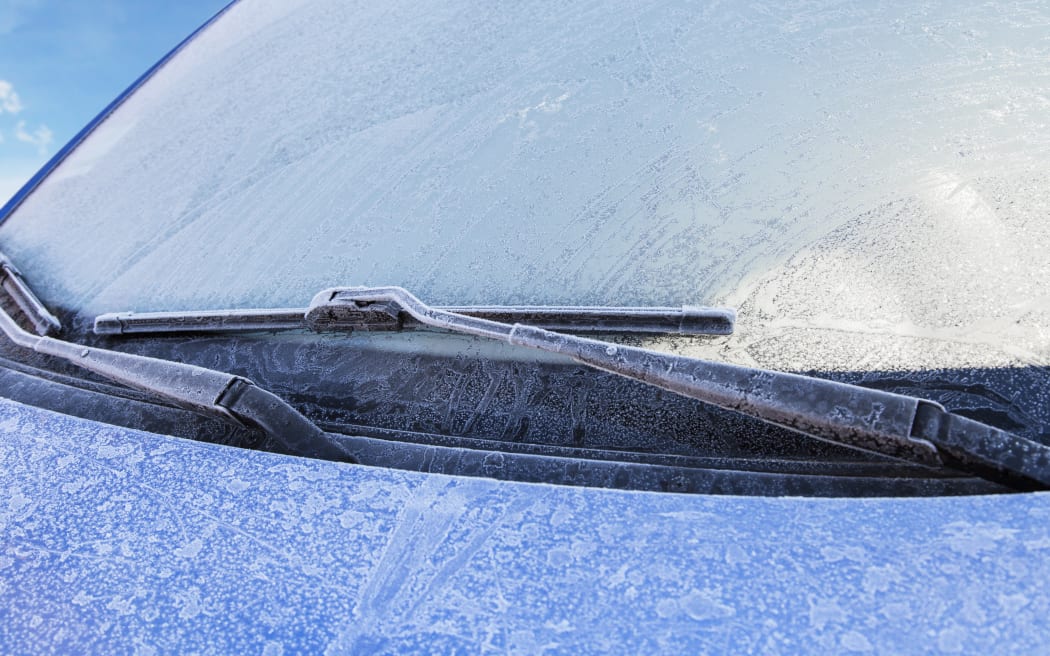 Frost covers a car's windshield on a cold winter morning (file photo)