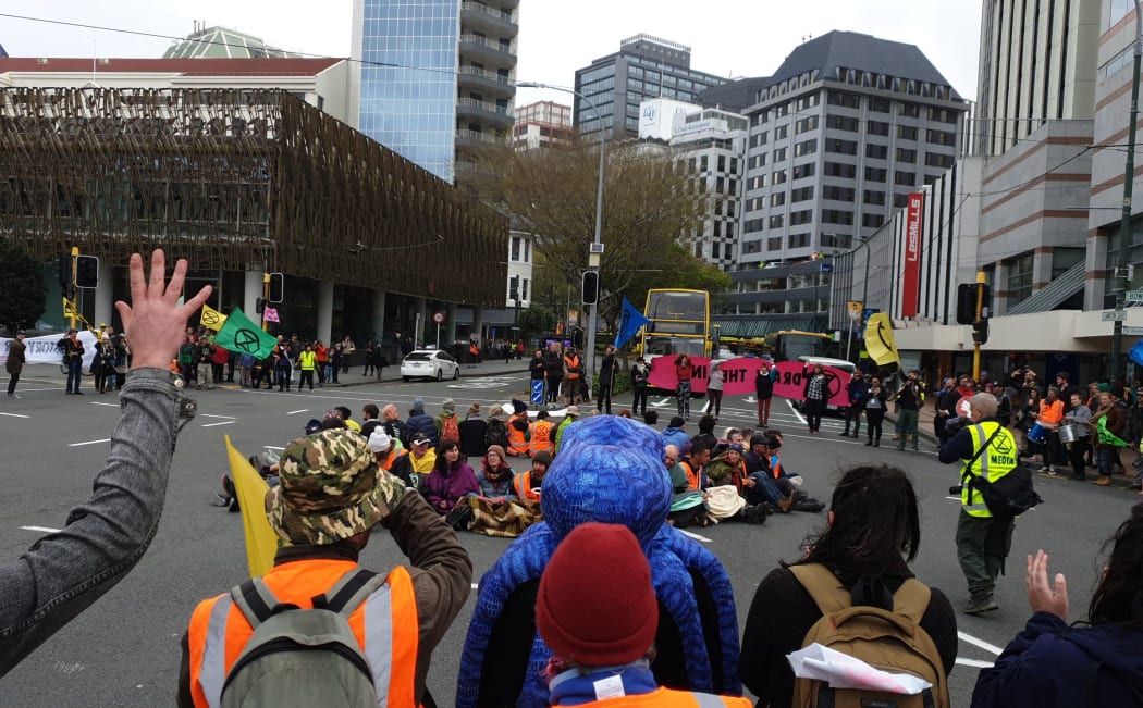 Protesters blocking the corner of Lambton Quay and Stout Street in Wellington.