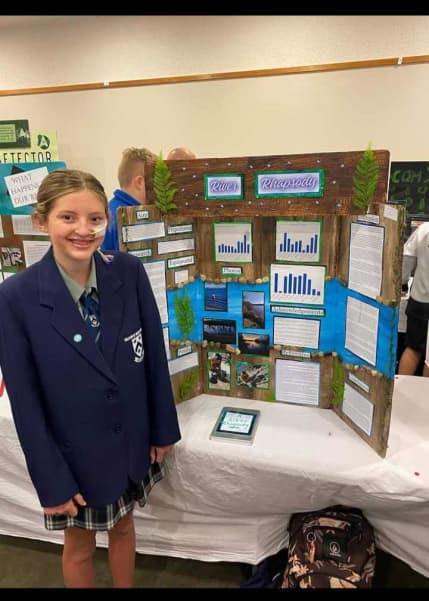 Amelia at a school science fair.