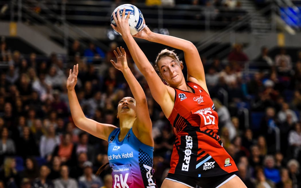 Ellie Bird of the Tactix fights Courtney Elliott of the Steel for the ball.