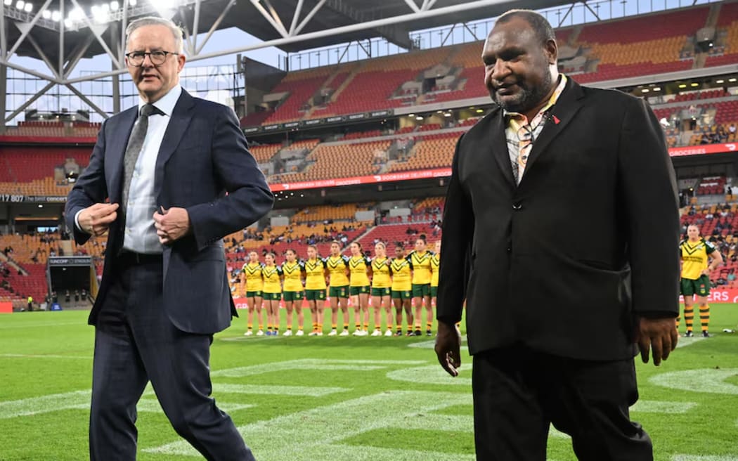 Anthony Albanese and James Marape, pictured at Suncorp Stadium in September, have announced the new PNG team will enter the NRL in 2028. (AAP: Darren England)