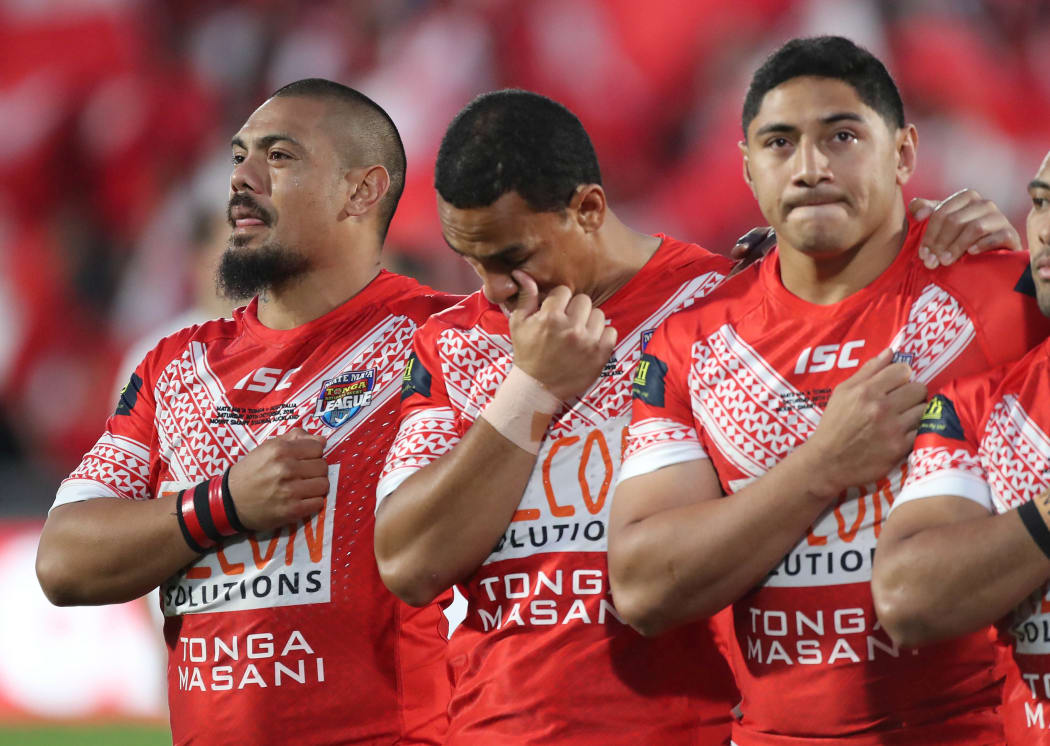Sika Manu, Will Hopoate and Jason Taumalolo during the Tonga national anthem prior to kickoff against the Kangaroos.