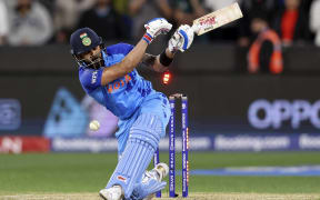 India's Virat Kohli is bowled no a free-hit ball during the ICC men's Twenty20 World Cup 2022 cricket match between India and Pakistan at Melbourne Cricket Ground (MCG) in Melbourne on October 23, 2022. (Photo by Martin KEEP / AFP) / -- IMAGE RESTRICTED TO EDITORIAL USE - STRICTLY NO COMMERCIAL USE --