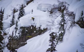 Zoi Sadowski-Synnott dropping a huge feature during the YETI Natural Selection Tour Revelstoke. Credit Tom Monterosso / Natural Selection Tour.