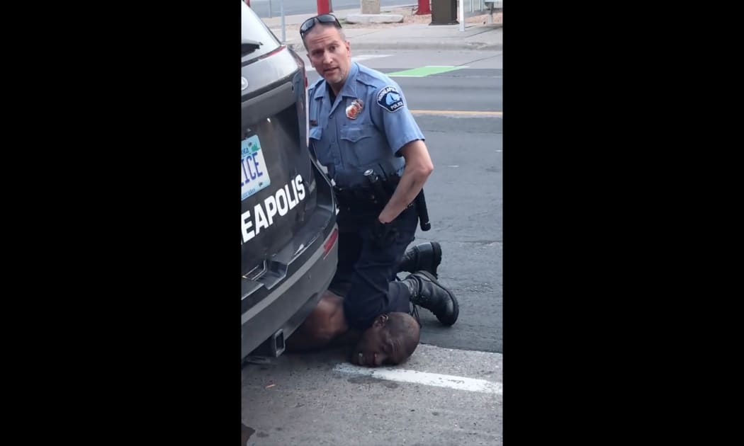 This still image taken from a May 25, 2020, video courtesy of Darnella Frazier via Facebook, shows a Minneapolis, Minnesota, police officer arresting George Floyd.