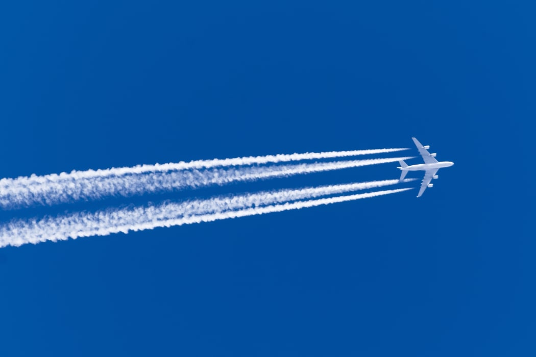 Airplane, contrail clouds. (file image)