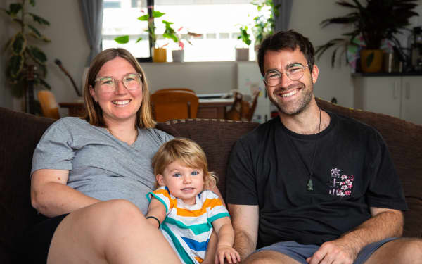 Sophie (left) and Jay Weir (right) with their daugher Winona sitting between them.