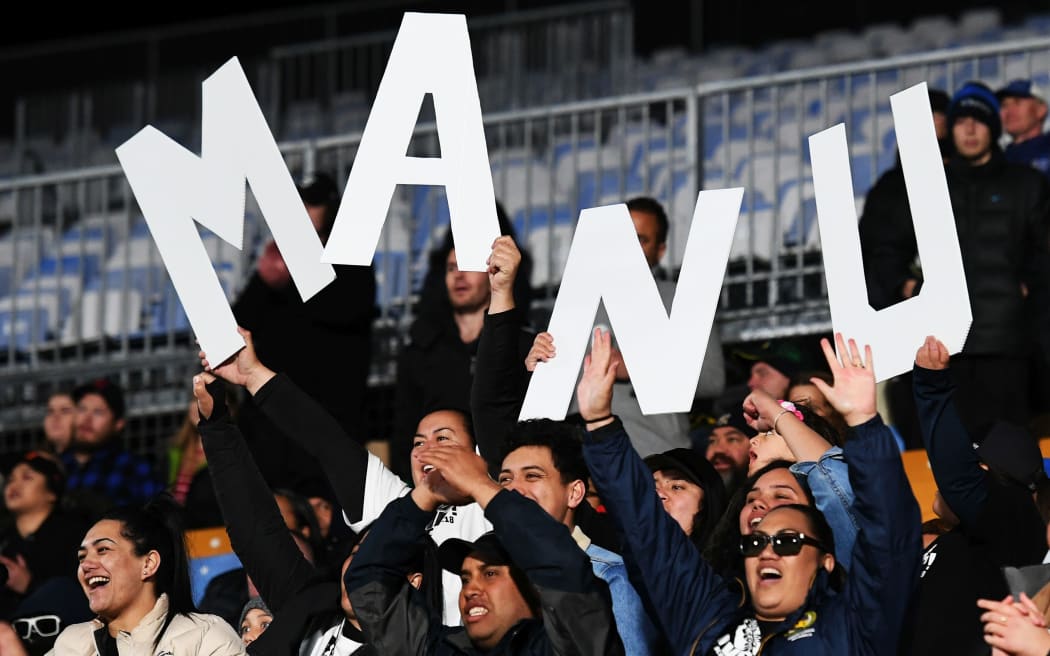 Joseph Manu's family and friends show their support for the Kiwis centre.