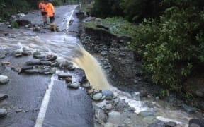 The slip has caused large trees, soil, rocks and streams to cut across the highway.