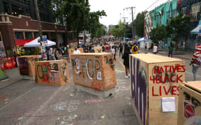 Barricades erected by the city several days ago divide up the CHOP zone in Seattle.