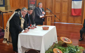 BJ Clark and Graham Yarrall sign a memorandum of understanding between the RSA and its French equivalent, Union Nationale des Combattants.