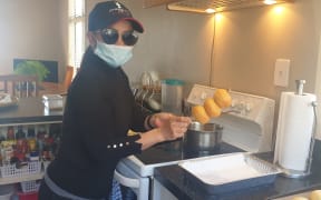 Nuri Puzey preparing Indonesian donuts
