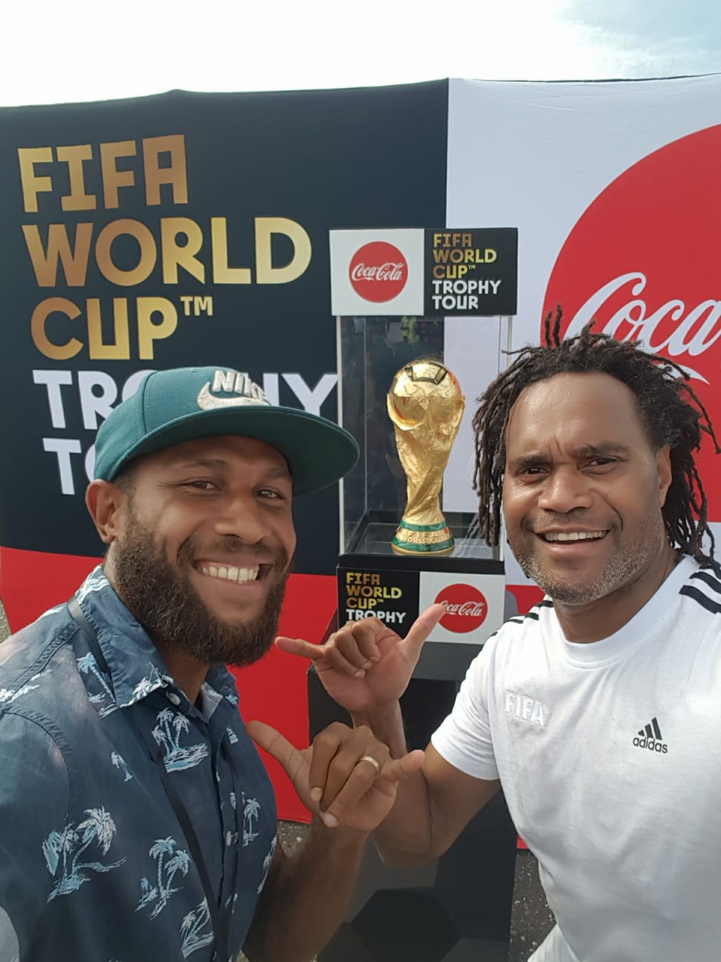 Solomon Islands National Football captain Henry Fa'arodo poses infront of the the FIFA World CUp Trophy with France's Christian Karembeu in Honiara, Solomon Islands. 01 February 2018