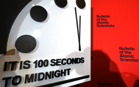 The Doomsday Clock reads 100 seconds to midnight.