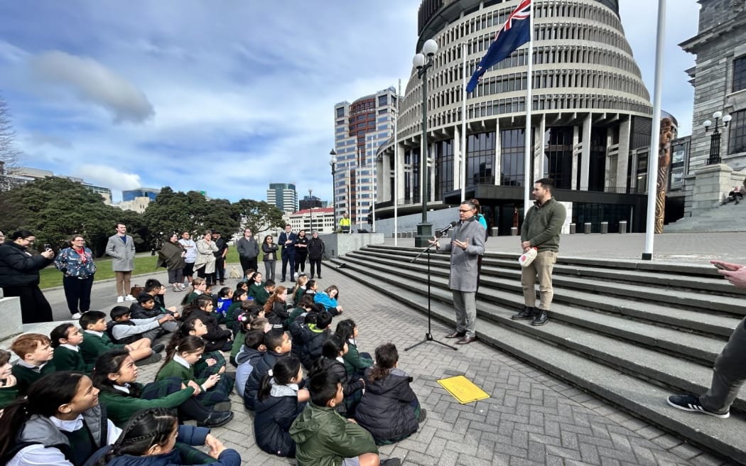 Children at the steps of Parliament tell politicians how worried they are about climate change.