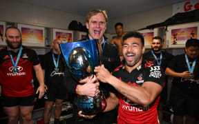 Scott Robertson and Richie Mo'unga celebrate after winning the 2023 Super Rugby Pacific title.