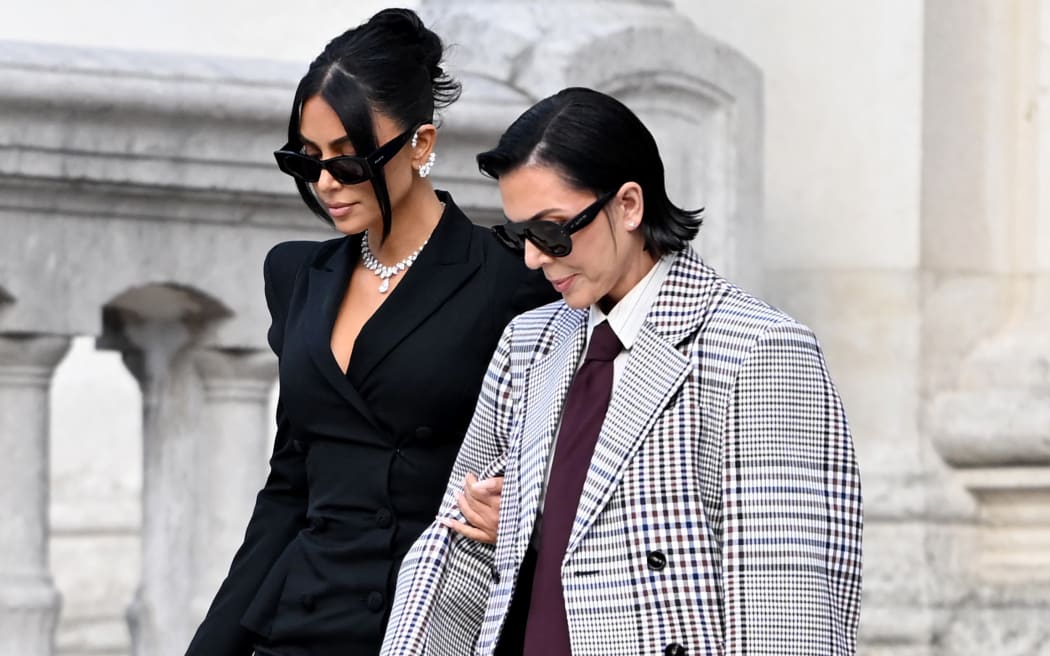 US celebrity Kim Kardashian (L) leaves with her mother Kris Jenner (R) the Assize Court after testifying in a trial over the 2016 robbery that saw her relieved of millions of dollars' worth of jewellery at gunpoint in Paris, on May 13, 2025. The trial of this sensational nine million euro jewellery robbery opened in Paris on April 28, 2025. (Photo by LEO VIGNAL / AFP)