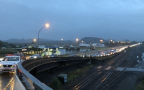 A long line of cars stretches more than 1km at a border checkpoint at Mercer.