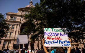 Abortion rights activists rally at the Texas State Capitol after lawmakers passed several pieces of conservative legislation, including SB8.