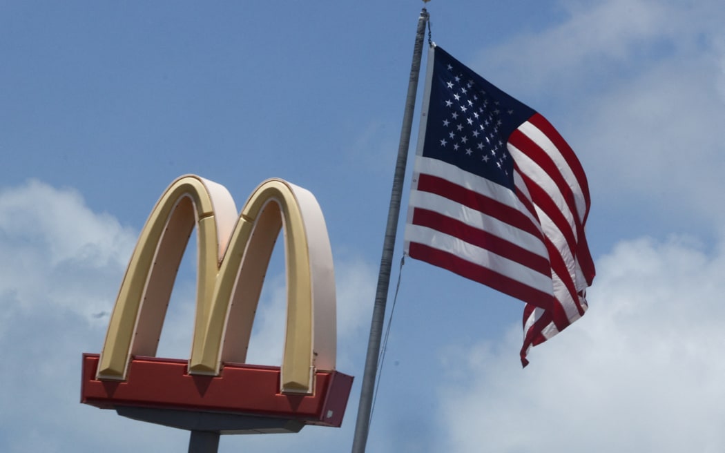 McDonad&#039;s logo and American flag are seen in Florida Keys, United States on May 7, 2024. (Photo by Jakub Porzycki/NurPhoto) (Photo by Jakub Porzycki / NurPhoto / NurPhoto via AFP)