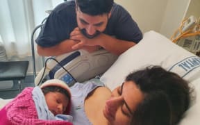 Rupinder Kaur and her husband Preetinder Singh with their newborn baby.