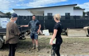 Jayde Demanser (right) and her husband Matt, with friend Bree Claudatos who helped with the clean up.