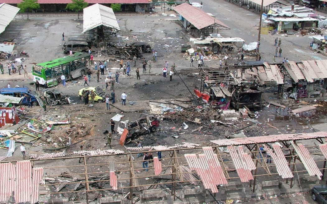 A general view shows the devastation after a bus station in Jableh, Syria was bombed.