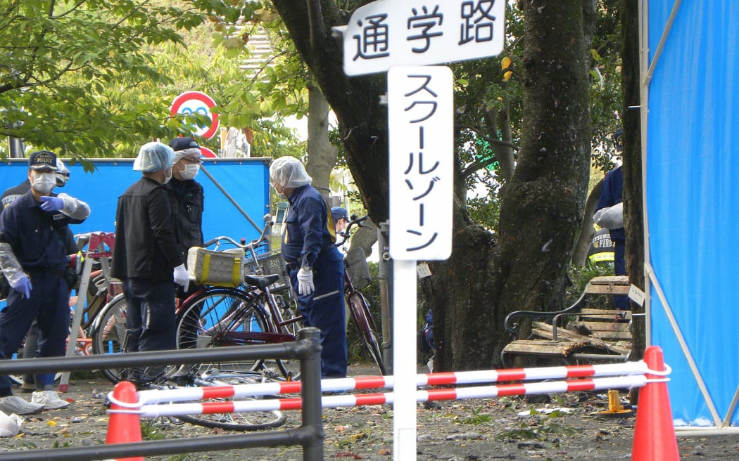 Policemen investigate an explosion site at a park in Utsunomiya, some 100 kilometres (60 miles) north of Tokyo on October 23, 2016