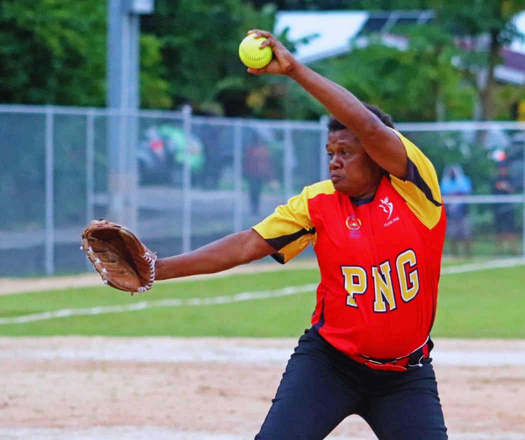 Team PNG's softball player Rosa Maira delivering one of her pitches against Northern Marianas on the first day of competition. Team PNG put up a strong challenge against Northern Marianas to hold off a strong finish by their opponents to win 7-6.