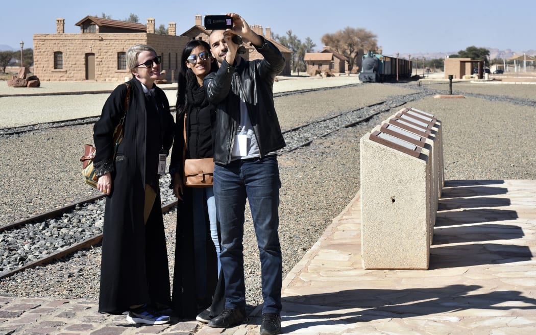 A picture taken on January 4, 2019, shows a people visiting the Hejaz train station near Saudi Arabia's northwestern town of al-Ula, an Ottoman era railway.