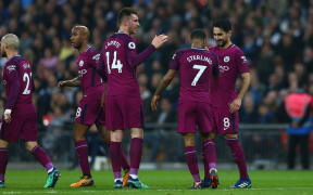 Manchester City celebrate a goal against Tottenham Hotspur.