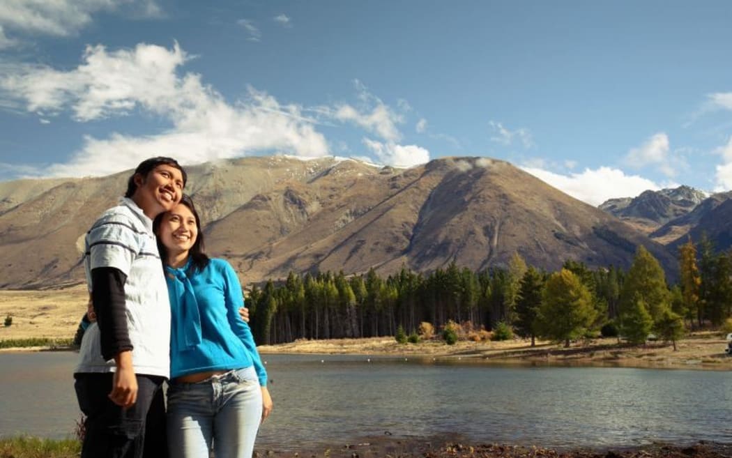 Asian couple enjoying NZ scenary