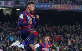 The Barcelona striker Neymar celebrates scoring a goal.