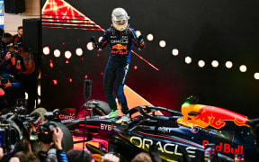 Red Bull Racing's  Max Verstappen celebrates after winning the Qatari Formula One Grand Prix at the Lusail International Circuit. December 2024.