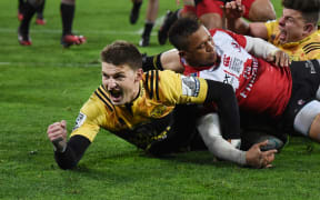 Hurricanes player Beauden Barrett celebrates scoring a try during the
Super Rugby Final between the Hurricanes and Lions.