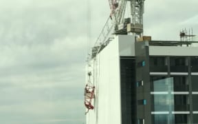 The crane was left dangling over the side of the North Sydney building.