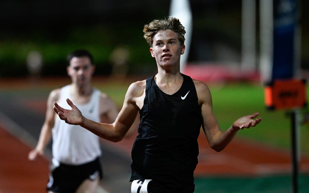 15 yr old track athlete Sam Ruthe becomes the youngest person ever to break the magic 4 minute mile barrier as pace setter Sam Tanner looks on.