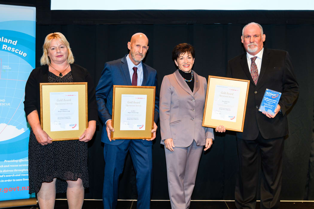 Gold Award winners Mandy Jackson, Joe Adam and Steve Orr with Dame Patsy Reddy.