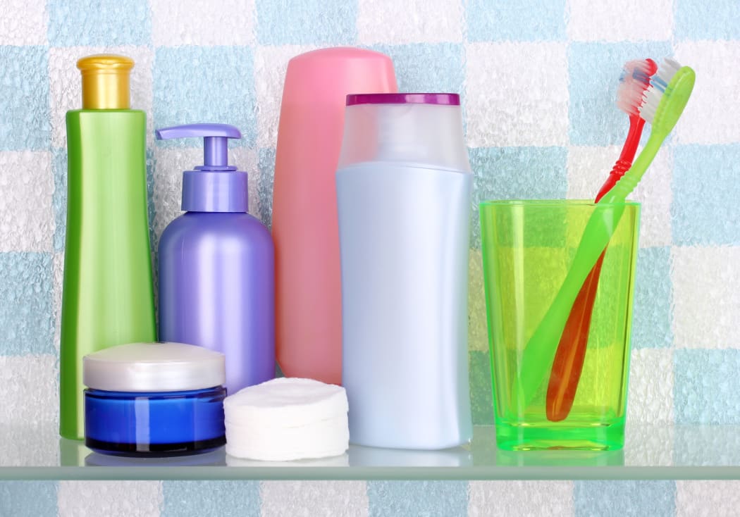 A collection of personal hygiene and body care products, including toothpaste, soap and body wash.