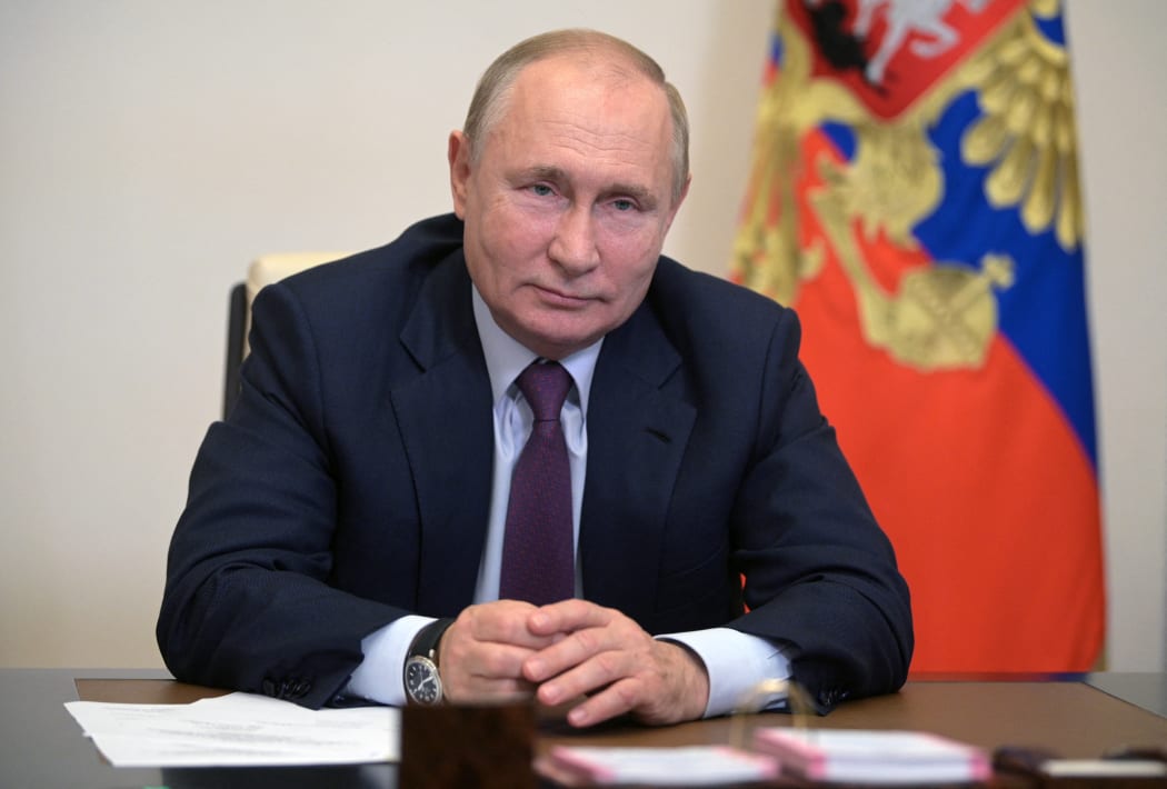 Russian President Vladimir Putin is pictured during a meeting with Russian Prime Minister Mikhail Mishustin and Deputy Prime Ministers via a video linkup from the House of the Russian government, in Moscow, Russia.