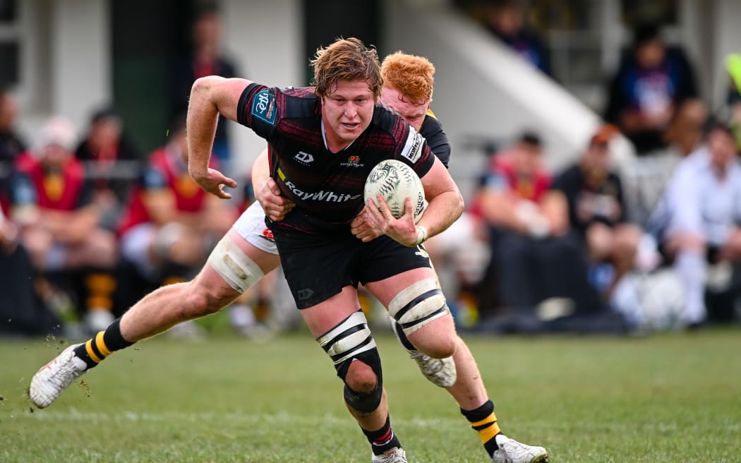 Cullen Grace of Canterbury is tackled by Tom Florence of Taranaki.