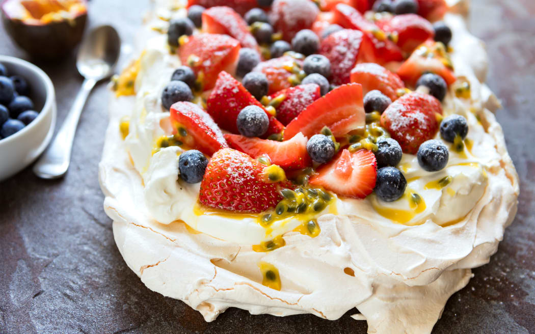 Pavlova with berries and passionfruit.