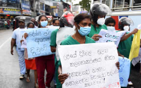 Doctors, paramedics and workers of Maussakalay hospital at Hatton in Sri Lanka protesting over the country's economic crisis on 8.4.22. "We are worried. There is a huge shortage of medicines and there is no diesel for the ambulances," one protester said.